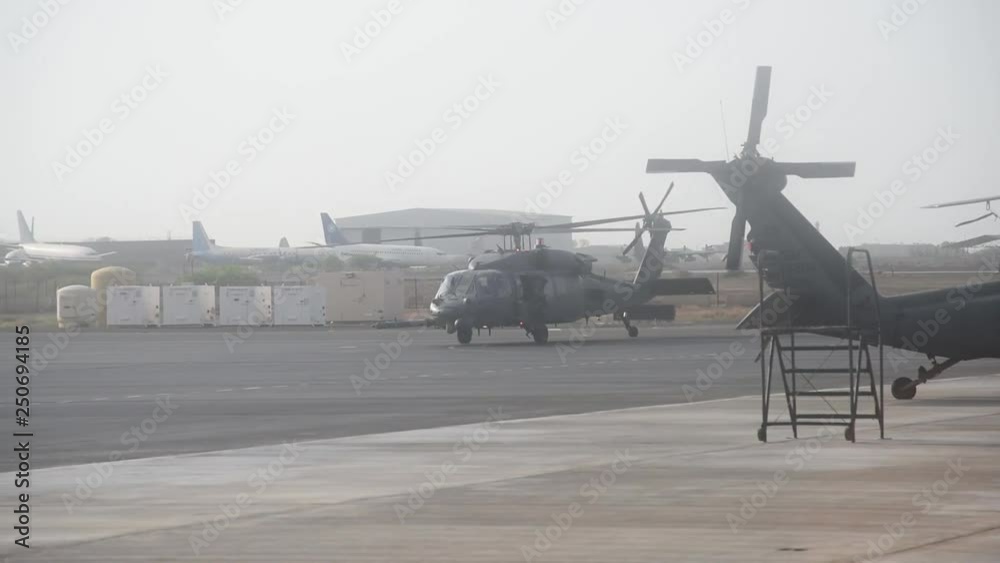 Army helicopter ending its landing on base