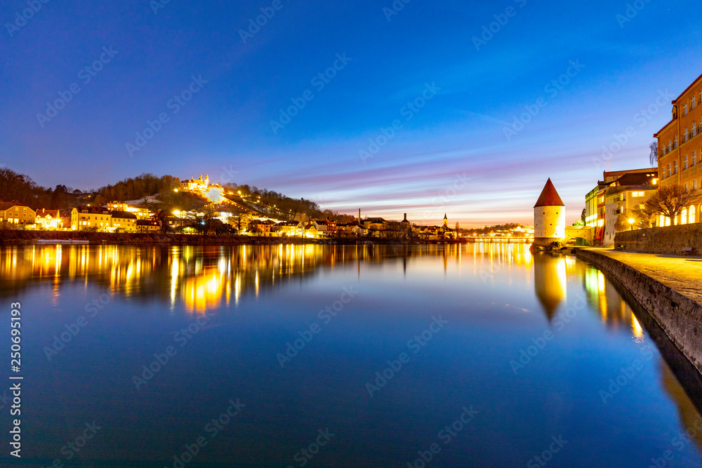 river inn view at Passau in Bavaria with reflection of promenade by night