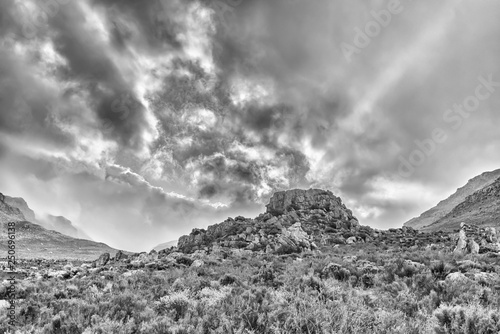 Storm clouds at sunrise at Kromrivier in the Cederberg Mountains. Monochrome