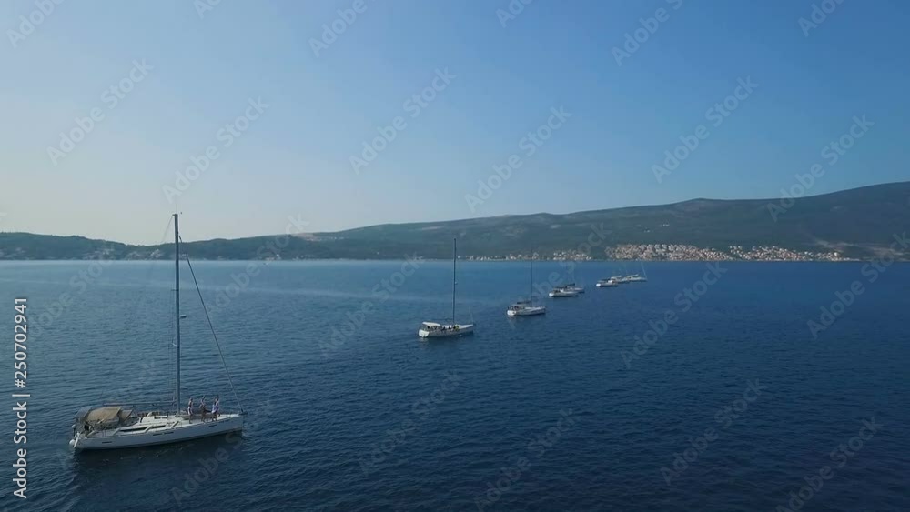 Aerial. Eight yachts lined up on Adriatic sea in Montenegro Aerial. Eight yachts lined up on Adriatic sea in Montenegro