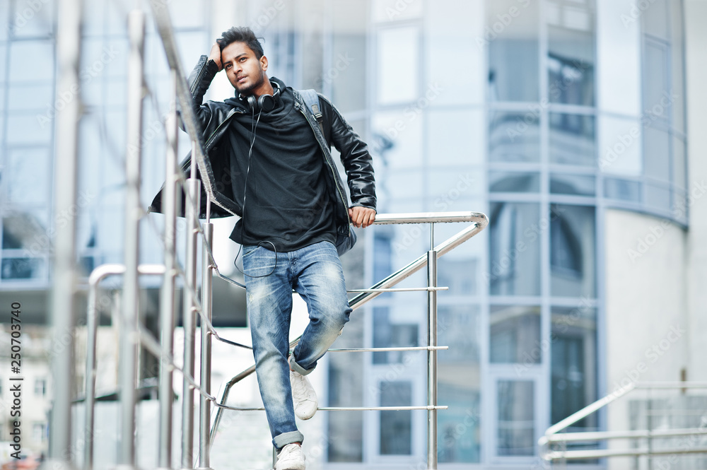 Stylish and casual asian man in black leather jacket posed near the railing  against modern building. Stock Photo | Adobe Stock