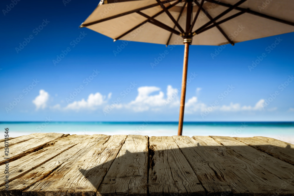 Desk of free space on beach and umbrella with shadow Desk of free space on beach and umbrella with shadow