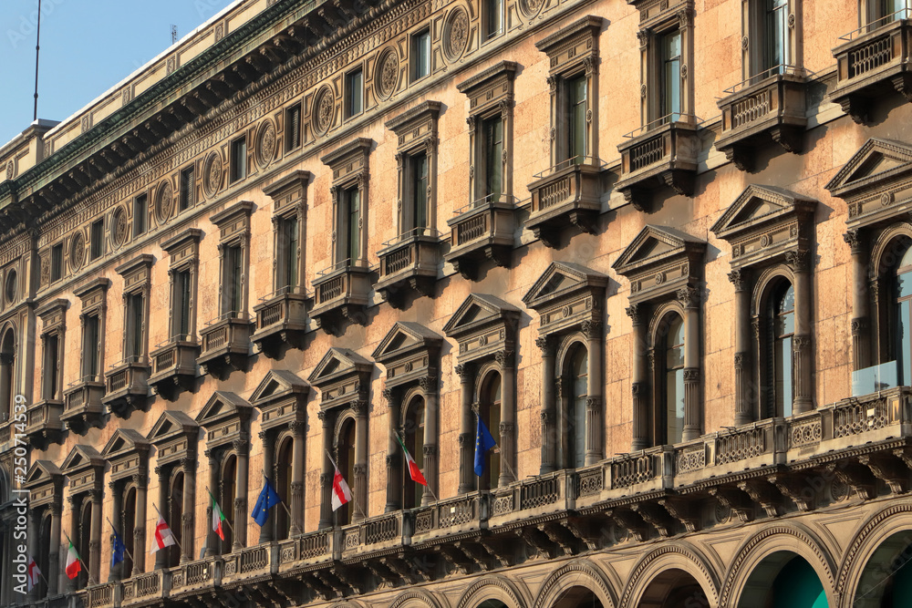 Palazzo storico con bandiere a Milano in Italia, Historic palace with flags in Milan in Itly 