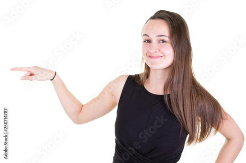 Attractive smiling girl standing and pointing finger up