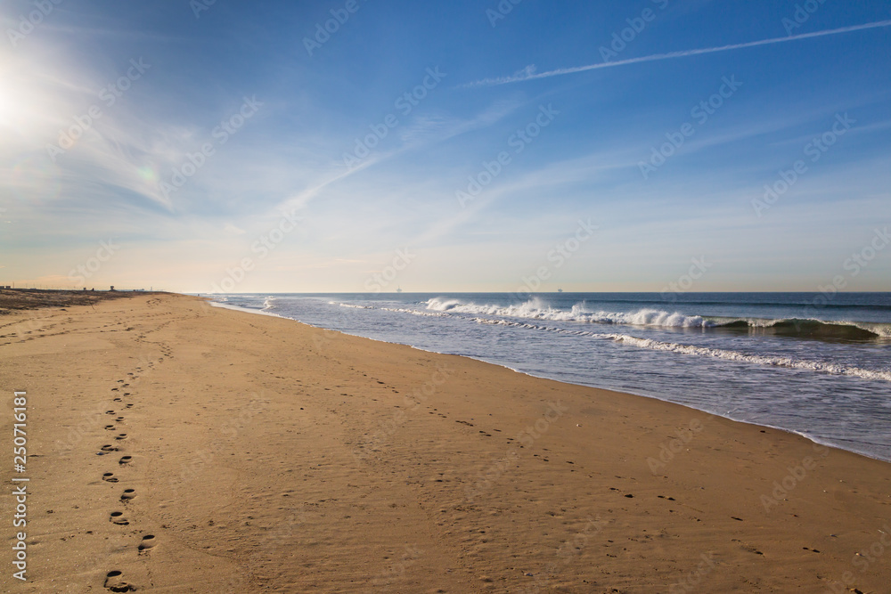 Looking along the wide sandy beach, at Sunset Beach on the Californian Coast Looking along the wide sandy beach, at Sunset Beach on the Californian Coast