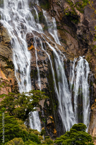 New Zealand  South Island. Fiordland National Park  Milford Sound  Piopiotahi . Lady Bowen Falls  Milford   s highest waterfall 