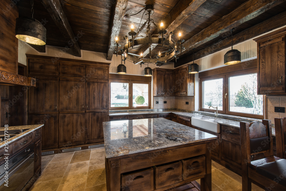 Wooden ceiling, retro chandelier and countertop in kitchen inteior Wooden ceiling, retro chandelier and countertop in kitchen inteior