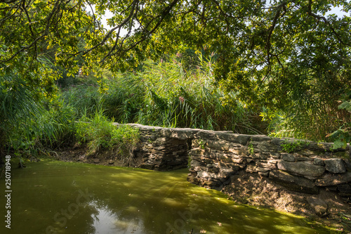 The small roman footbridge Pont de Gras near Saint-Lyphard on a sunny day in summer