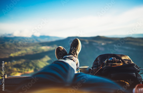 view trekking feet tourist backpack photo camera in auto on background panoramic landscape mountain, vacation concept, foot photograph hiking relax in auto, photographer enjoy trip holiday, mockup sky