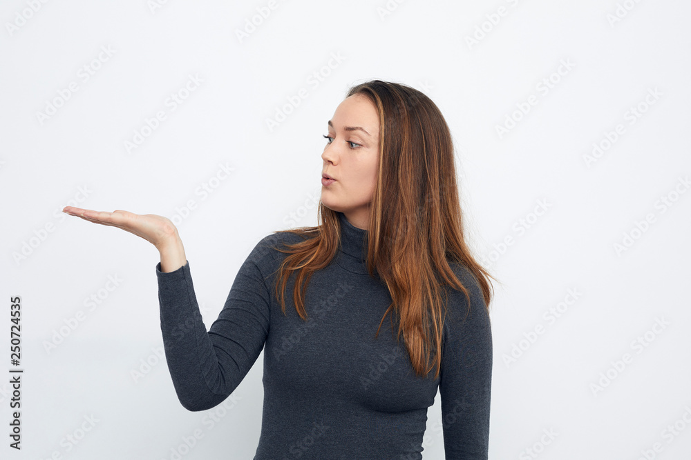 young happy woman presenting your product on white background young happy woman presenting your product on white background