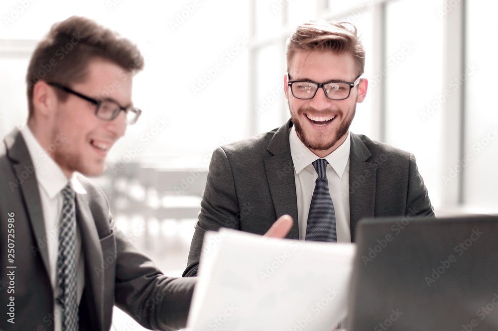 business partners discussing business document. business partners discussing business document.