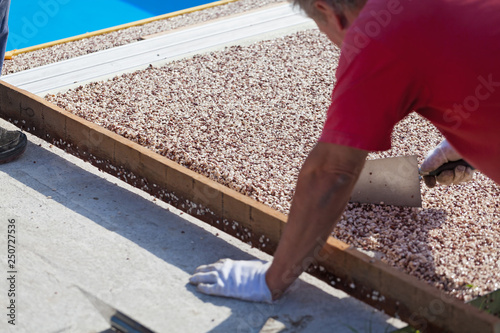 Laying the floor around the outdoor pool.
