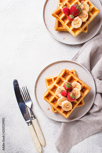 Waffles with strawberries and banana