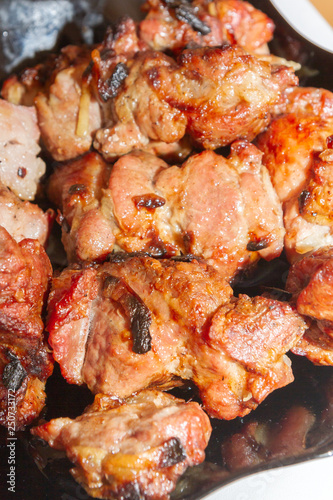 Delicious appetizing shish kebab of pork meat is in the plate