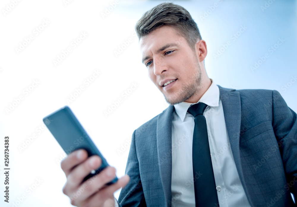 serious businessman with phone reading message serious businessman with phone reading message