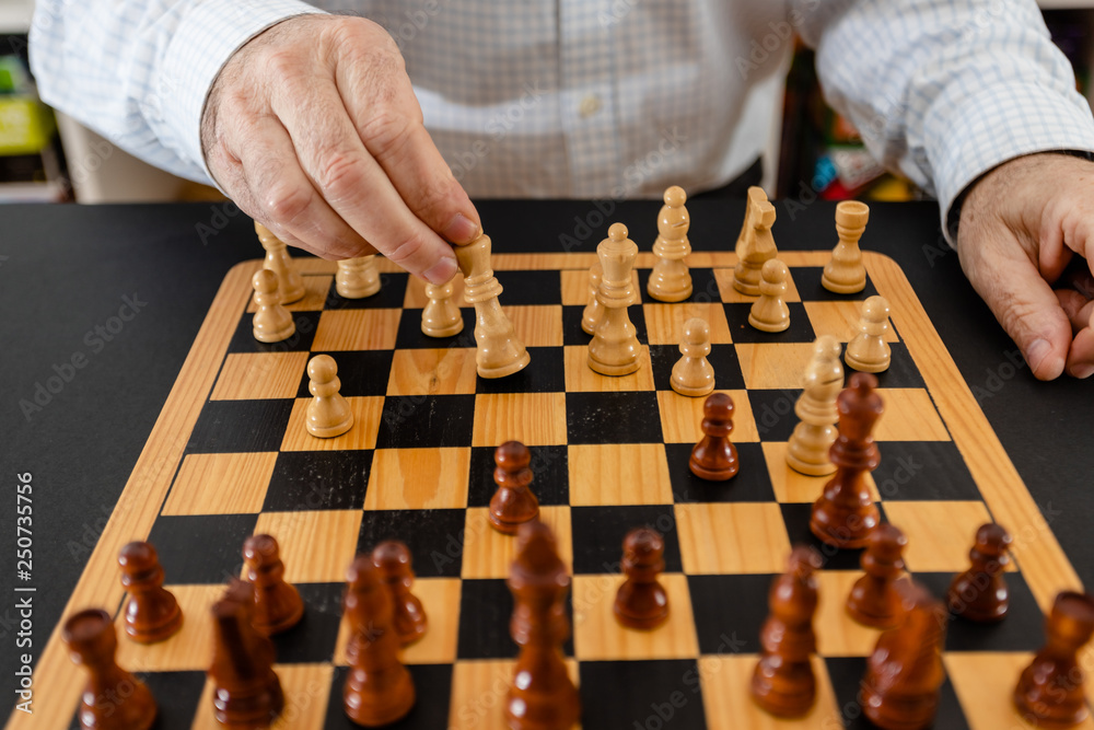 Business man moving chess figure with team behind. strategy or leadership concept. Business man moving chess figure with team behind. strategy or leadership concept.