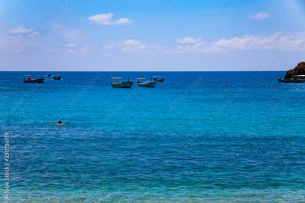 Holiday concept image with sea and sky. Beautiful scenic with blue sky and sea with islands by the side Holiday concept image with sea and sky. Beautiful scenic with blue sky and sea with islands by the side
