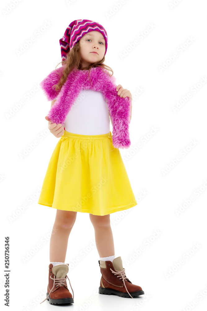 Little girl in a hat and scarf. Little girl in a hat and scarf.