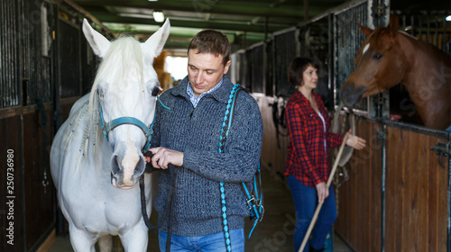 Man in casual clothes who works at stable