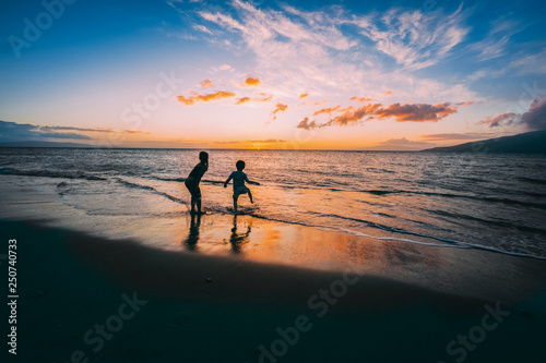 Kids playing in sunset