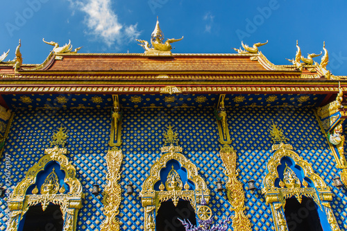 Beautiful public Buddhist church at Wat Rong Sua Ten in Chiang Rai, Thailand. Wat Rong Suea Ten (Temple of Tigers Leaping over Channel) or the Blue Temple is above all its magnificent blue interior. photo