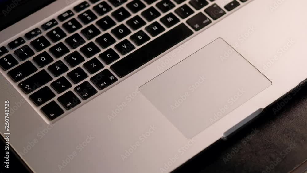 Close-up shot of man scrolling a website using laptop track pad. Close-up shot of man scrolling a website using laptop track pad.