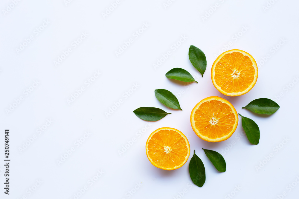 Fototapeta premium High vitamin C. Fresh orange citrus fruit with leaves isolated on white.