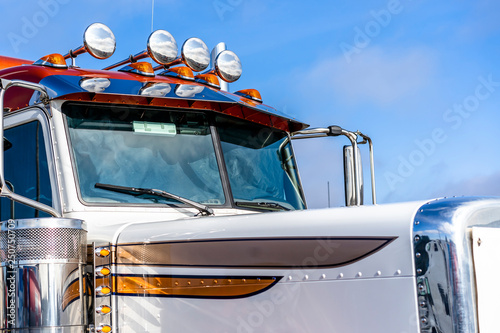 Part of big rig semi truck with audio horns on the roof photo