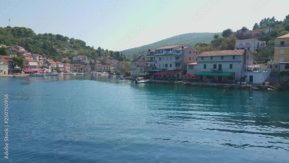 View of famous fisherman village at island Solta south of Split from Boat tour entertainment. Sunny summer day, Croatia, Split in the central Dalmatian. Mobile smart phone footage. View of famous fisherman village at island Solta south of Split from Boat tour entertainment. Sunny summer day, Croatia, Split in the central Dalmatian. Mobile smart phone footage.