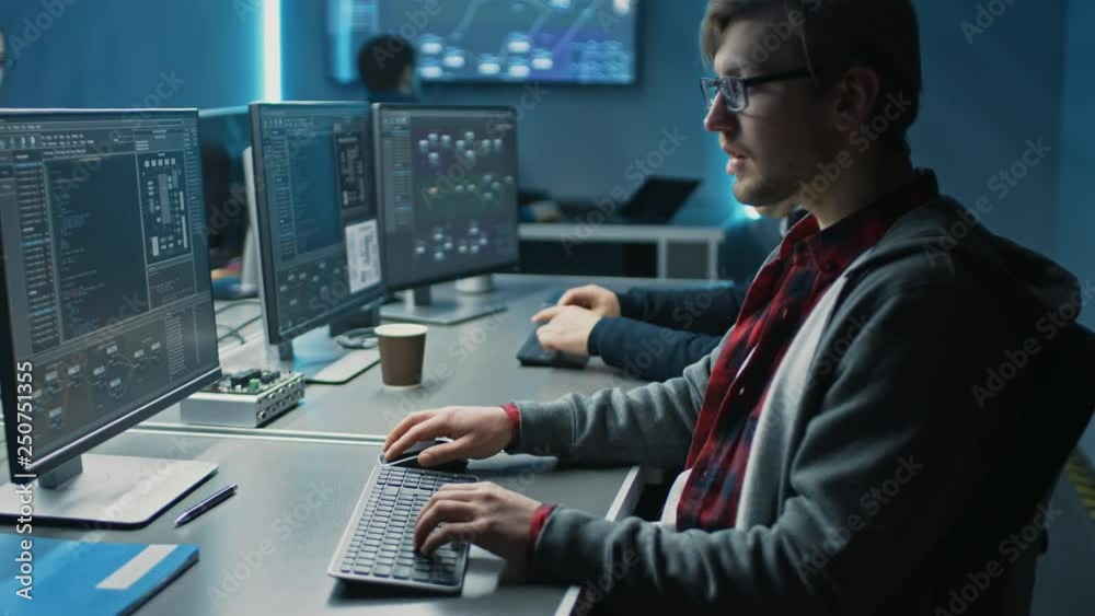 Team of IT Programers Working on Desktop Computers in Data Center Control Room. Team of Young Professionals Working In Software and Hardware Development, Doing Coding 