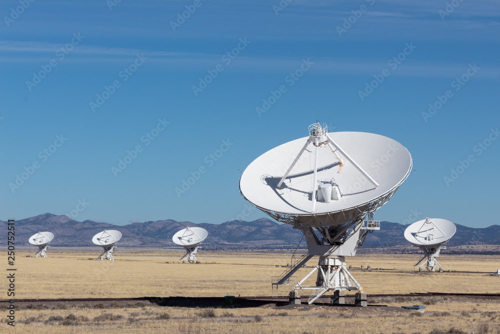 Very Large Array arrangement of radio telescope dishes in the desert, winter, science and technology, copy space, horizontal aspect