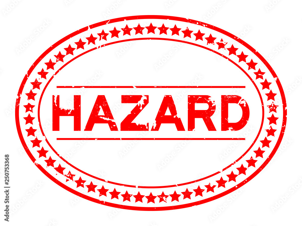 Grunge red hazard word oval rubber seal stamp on white background
