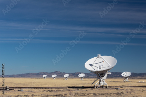 Very Large Array of radio astronomy observatory dishes in winter, science and technology, horizontal aspect photo