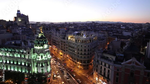 WS HA Cityscape at dusk with traffic on Gran Via and Metropolis Building / Madrid, Spain
