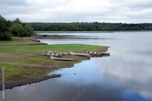 Boats on the shore of lake.Ireland. 