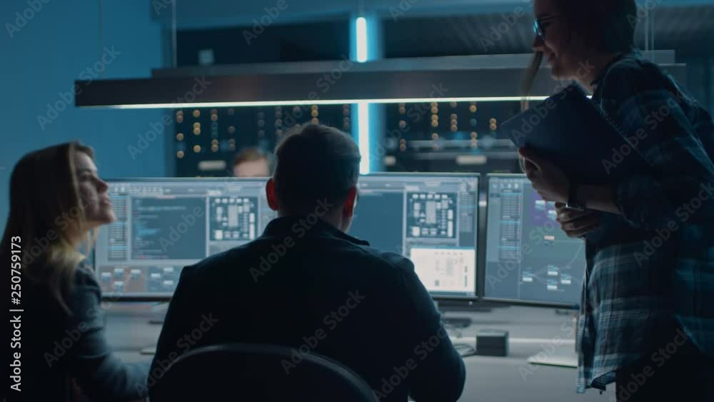 Male and Female IT Engineer Programmers Coding on Desktop Computers in ...