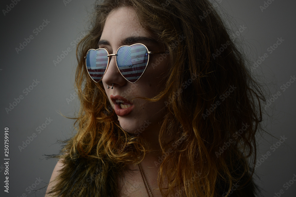 Woman in American sunglasses studio fashion Woman in American sunglasses studio fashion
