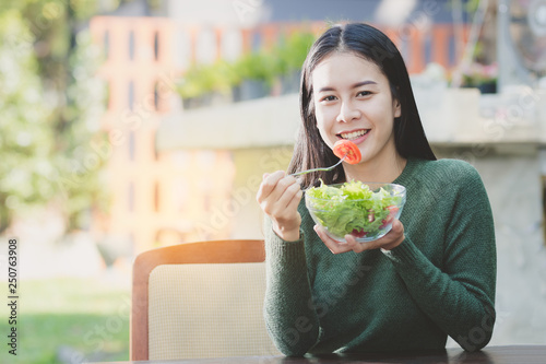 Wallpaper Mural  beautiful Asia woman,teen,girl eating useful food with happy. Torontodigital.ca