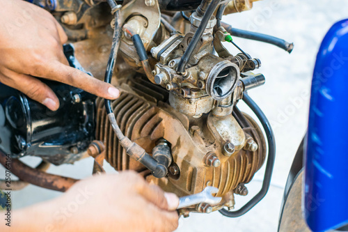 Engineers are repairing engines with tools.
