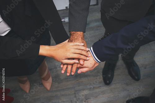 Business people joined hands,Teamwork concepts for commitment to Success