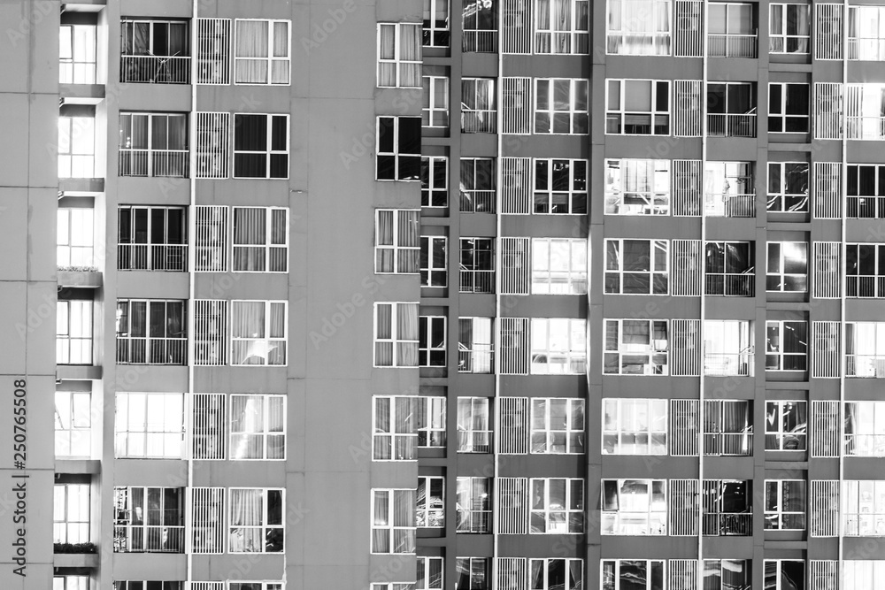 Close up a construction of apartment or residential building with many windows
