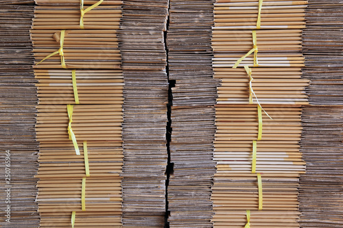 Stack of cartons and paper waiting to waste processing plant sorting recyclable materials.