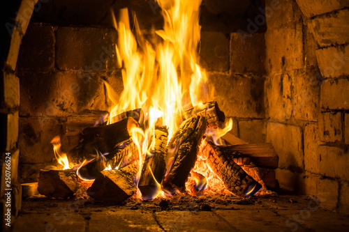 Wood burning in a cozy fireplace at home, keep warm