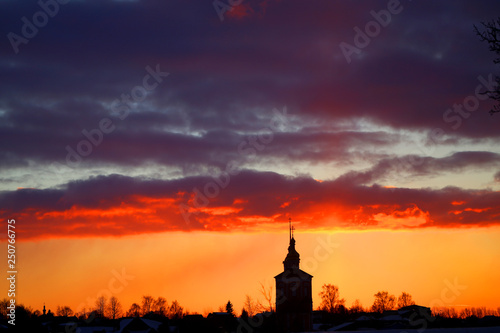Vivid pictures of the sunset in the winter with the Church in Russia