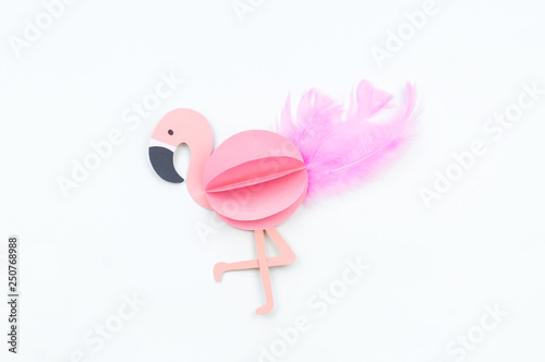 Pink flamingo made of paper. White background. © Дарья Колпакова