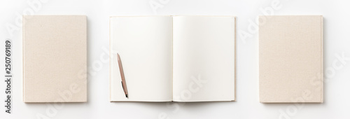 Business concept - Top view collection of  light yellow fabric notebook front, back , pen and white open page isolated on background for mockup