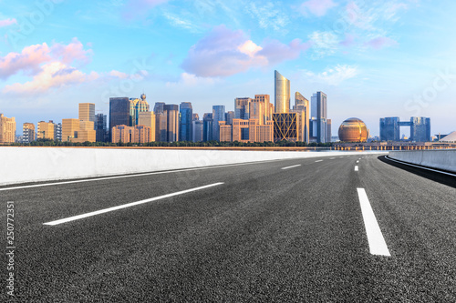 Empty asphalt road and modern city skyline with buildings in Hangzhou