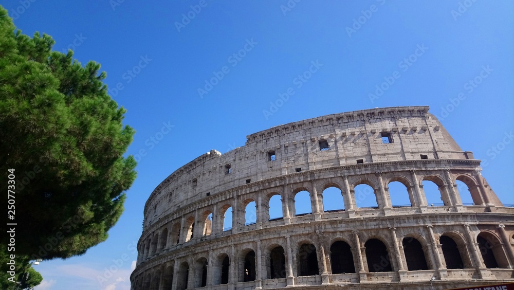 Colosseum or Flavian Amphitheatre with blue sky 
