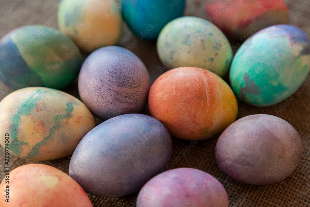 Group of Easter painted eggs on burlap Group of Easter painted eggs on burlap