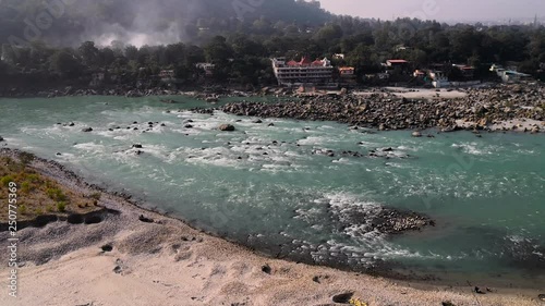 The Ganges river passes through Rishikesh in Uttarakhand, India photo